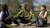 Three ISS students sitting in the park and chatting
